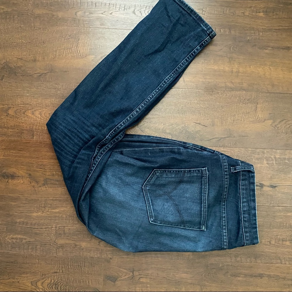 Worn Calvin Klein Blue Jeans